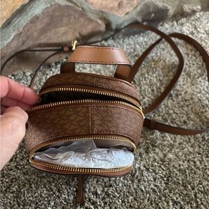 Compact Brown Backpack with Gold Zippers